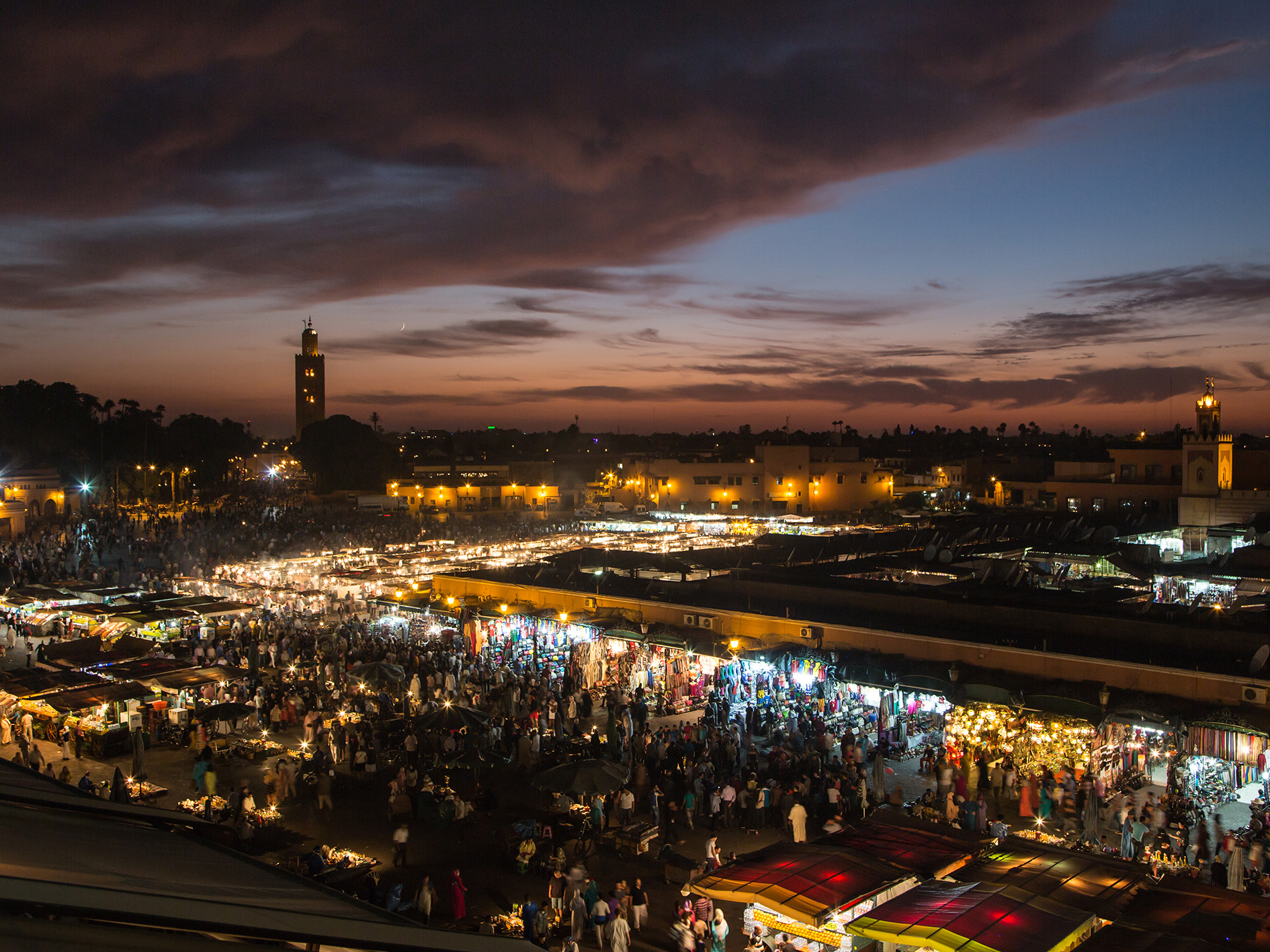 a birds eye view of Marrakech's main square at night 