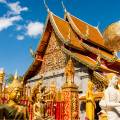 White Buddha statue in front of one of the many temples of Chiang Mai