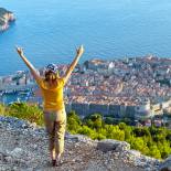 A woman enjoys panoramic views over Dubrovnik | Croatia