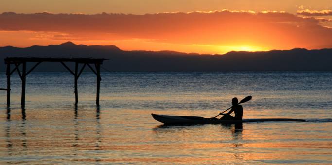 A fisherman in traditional canoe at Lake Malawi | Malawi