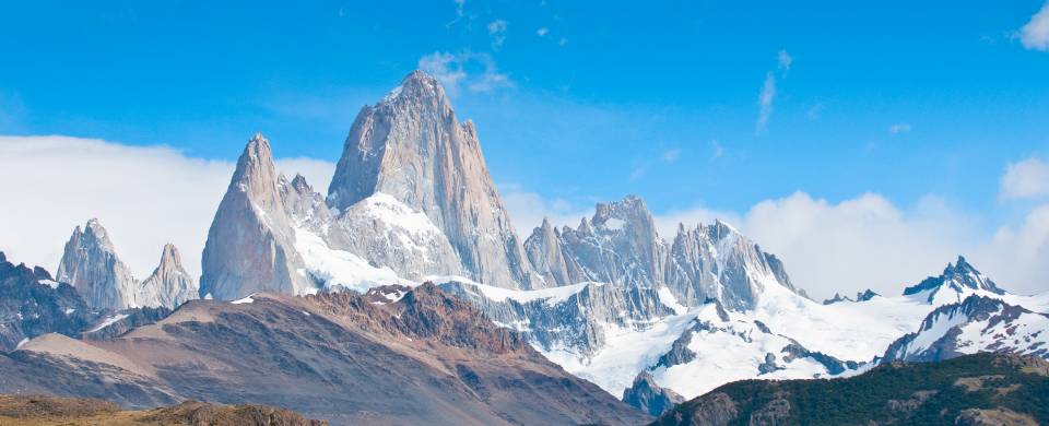 Snowy mountains dominating the landscape in El Chalten