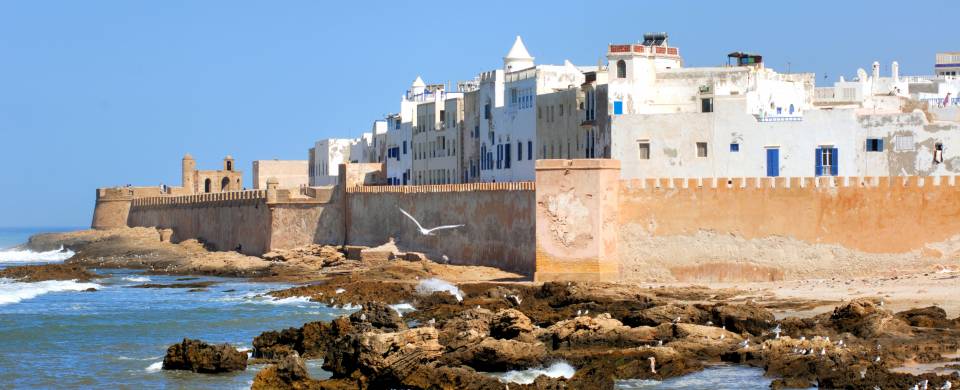 The walled city of Essaouira sitting on the edge of the water