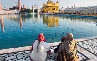 Family in front of Amritsar's Golden Triangle - India Tours - On The Go Tours