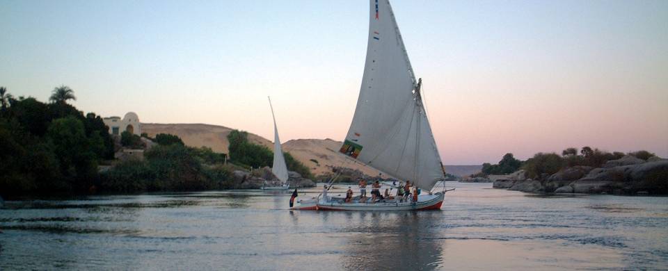 A felucca sailboat gliding across the water