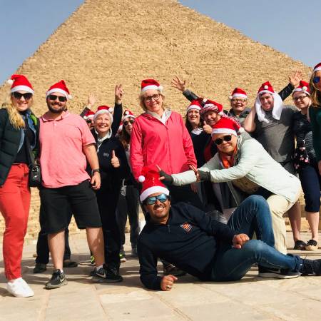 Festive King Ramses - tour group with santa hats