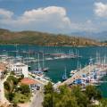 The town of Fethiye perched on the side of a mountain, overlooking to water