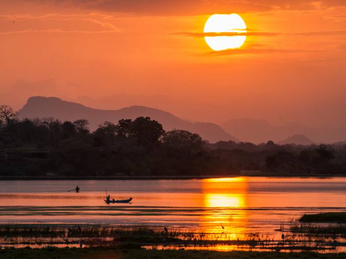 Fisherman in Arugam bay lagoon sunset, Sri Lanka