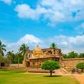 Brahadishwara Temple in Tanjore against a dazzling blue sky with wisps of cloud