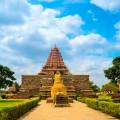 Brahadishwara Temple in Tanjore against a dazzling blue sky with wisps of cloud