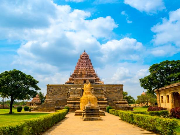 Brahadishwara Temple in Tanjore against a dazzling blue sky with wisps of cloud