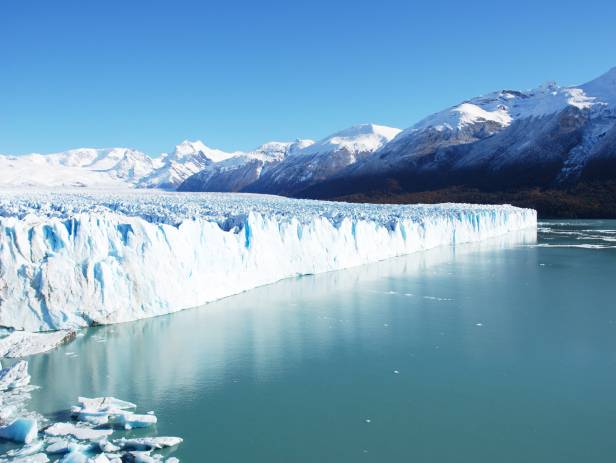 Impressive Perito Moreno glacier surrounded by snowy mountains in El Calafate