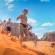 Group running down dune in Wadi Rum - Jordan Tours - On The Go Tours