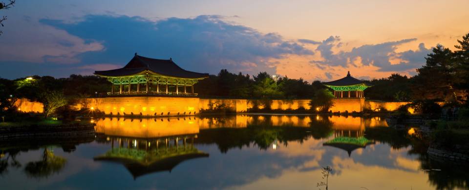 Pagodas lit up at night on the Anapji Pond in Gyeongju