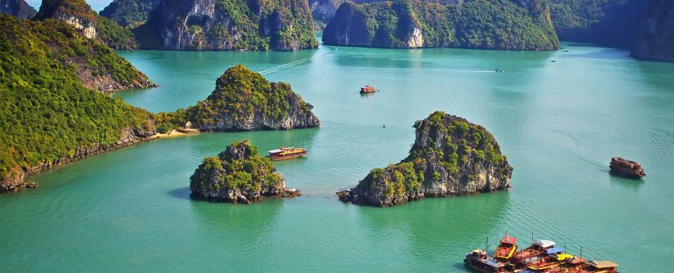 The jade coloured waters of Halong Bay studded with karst islands