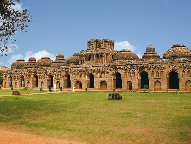 The ancient ruins, being reclaimed by nature, in Hampi