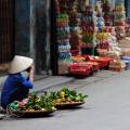 Hawker selling wares on the streets of Hanoi