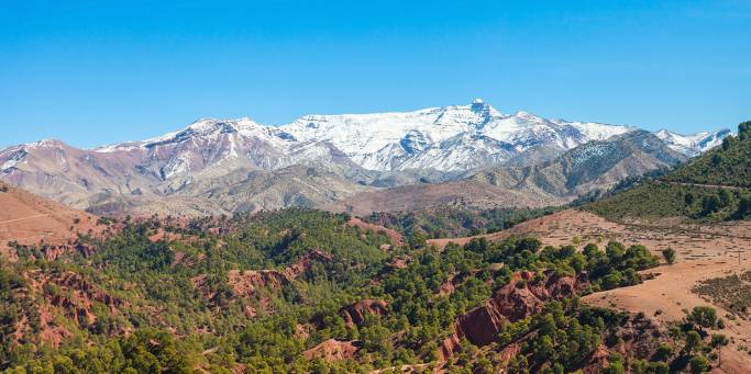 Admire the stunning High Atlas mountain range on your journey towards Ouarzazate | Morocco