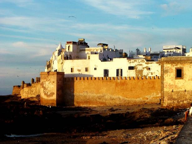 The walled city of Essaouira sitting on the edge of the water