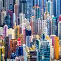 Train riding in front of the cityscape of Hong Kong