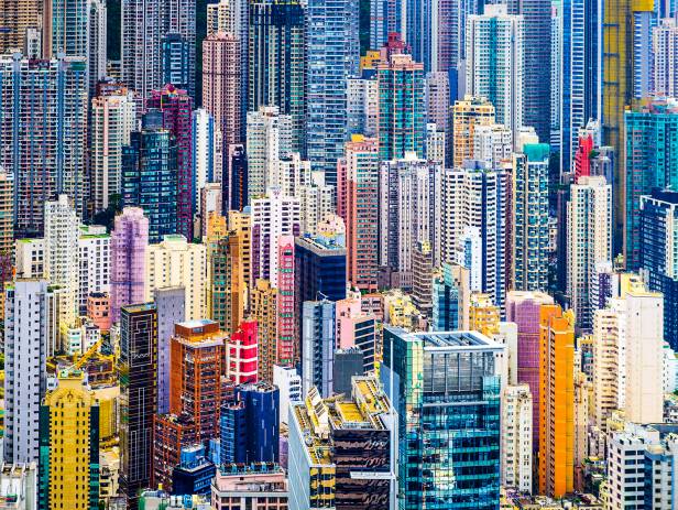 Train riding in front of the cityscape of Hong Kong