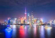 The bright city lights of the Pudong skyline seen from an evening pleasure boat cruise on the Huangp