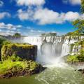 The majestic Iguazu falls creating white mist as they topple down