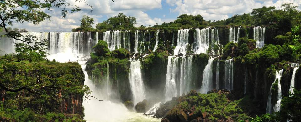 The majestic Iguazu falls creating white mist as they topple down
