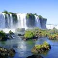 The majestic Iguazu falls creating white mist as they topple down