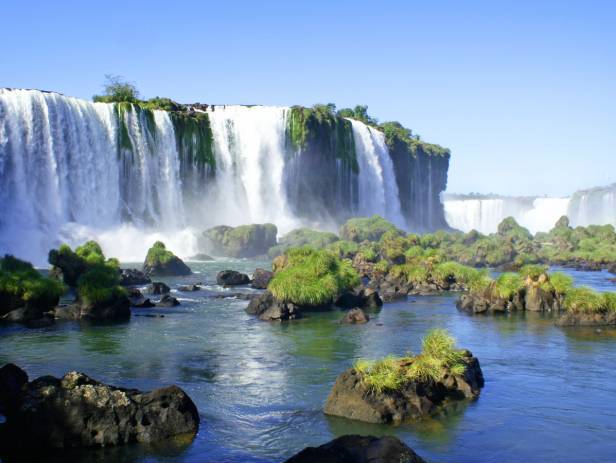 The majestic Iguazu falls creating white mist as they topple down