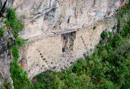 The remains of a drawbridge carved into a stone wall near Machu Picchu ruins