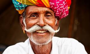 Indian man with colourful turban - India Tours - On The Go Tours