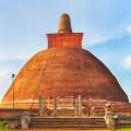 The setting sun behind a temple in Anuradhapura