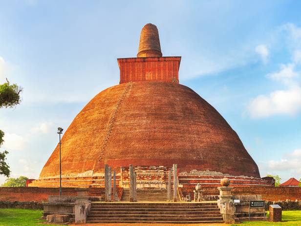 The setting sun behind a temple in Anuradhapura