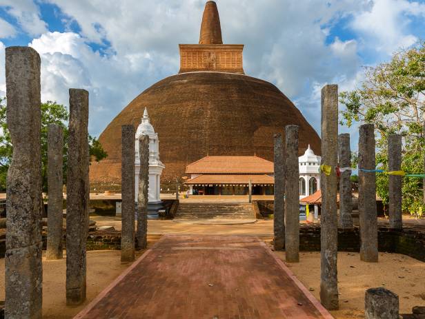 The setting sun behind a temple in Anuradhapura