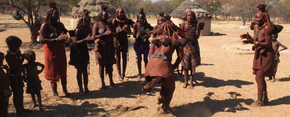 Himba tribespeople dancing in the harsh region of Kaokoland - Flickr credit Tee La Rosa