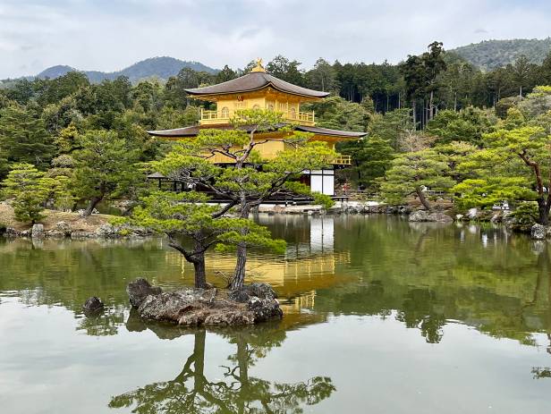Beautiful lake with a temple in the background in springtime in Kyoto