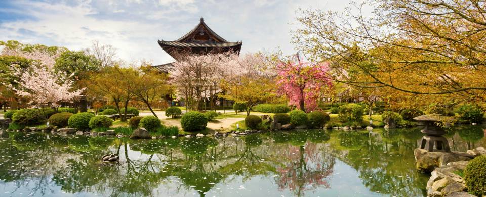 Beautiful lake with a temple in the background in springtime in Kyoto