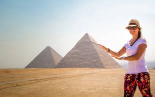 Lady pushing the pyramids - Egypt Tours - On The Go Tours copy