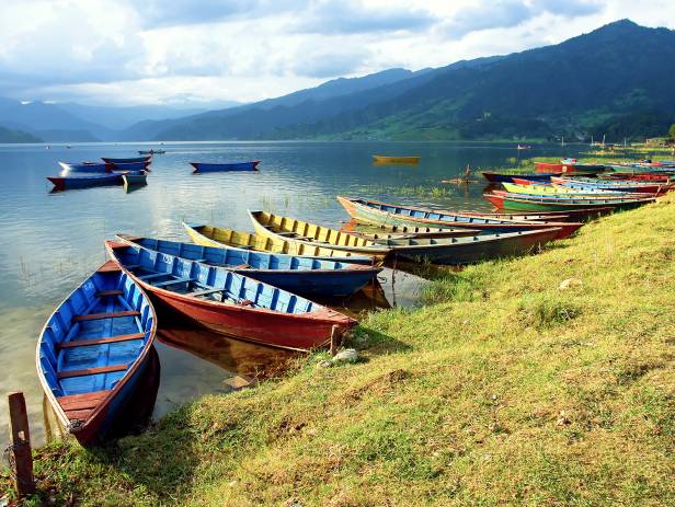 Colourful boats on the edge of the lake in Pokhara