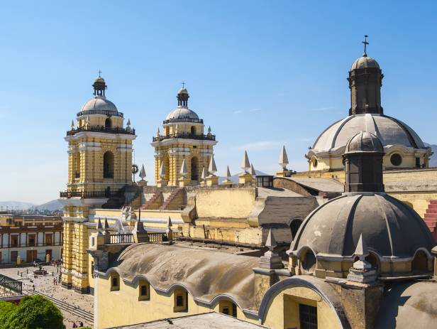 View across the Plaza Mayor in Lima with mountains in the background