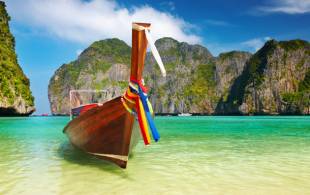 Long boat and beach - Best time to visit Thailand - On The Go Tours