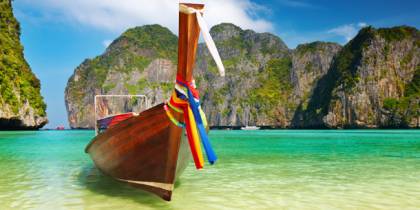 Long boat and beach - Best time to visit Thailand - On The Go Tours