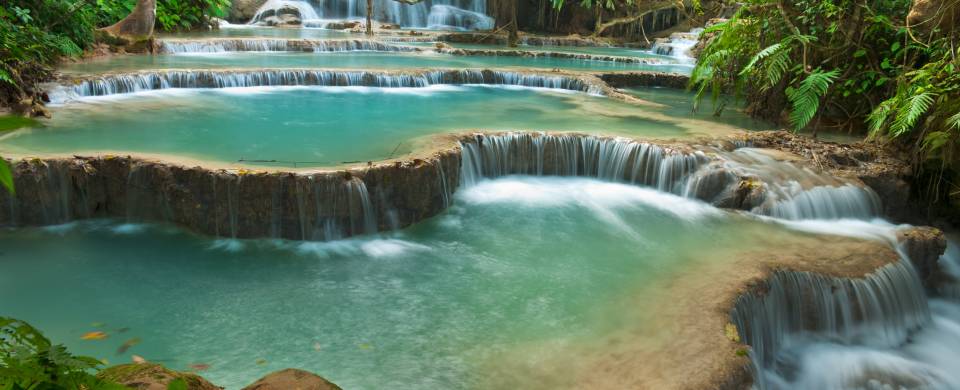 Stunning waterfall with aquamarine water in Luang Prabang