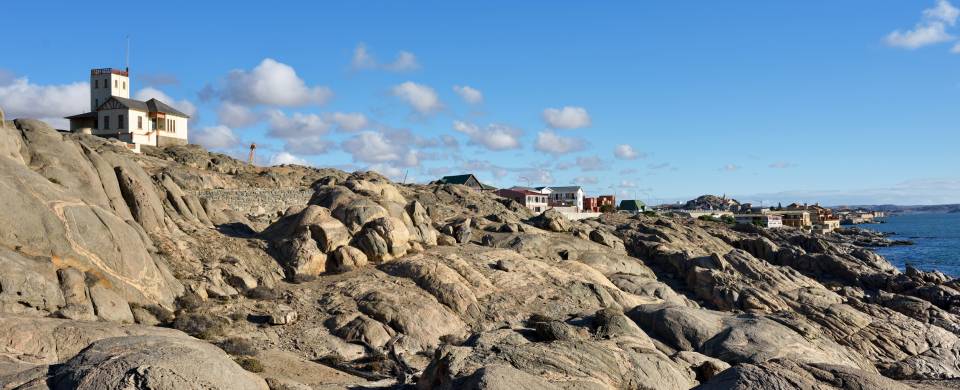 House sat upon rocks stretching out in to the sea at Luderitz
