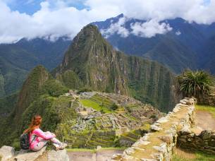 Machu Picchu with woman in the foreground - Peru Tours - South America Tours - On The Go Tours