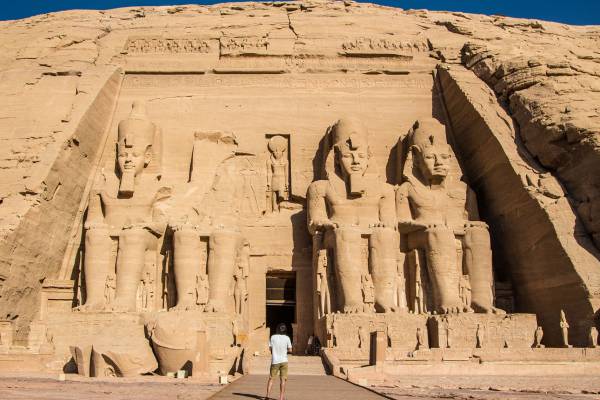Man standing in front of Abu Simbel - Egypt Tours - On The Go Tours