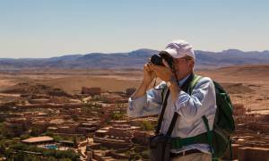 Man taking a photograph in Ait Benhaddou - Morocco Tours - On The Go Tours