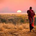 Masai Mara tribespeople standing in a row wearing colourful clothes