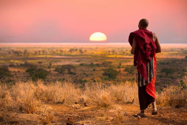 Masai Man watching sunset - Africa Overland Safaris - Africa Lodge Safaris - Africa Tours - On The G