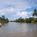 Boat rowing its way along the Mekong Delta